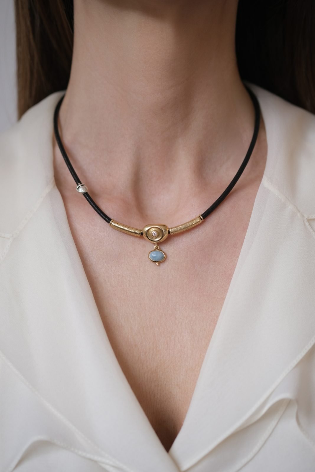 LEATHER NECKLACE WITH 18K GOLD NUGGET, DIAMOND AND MILKY CABOCHON AQUAMARINE
