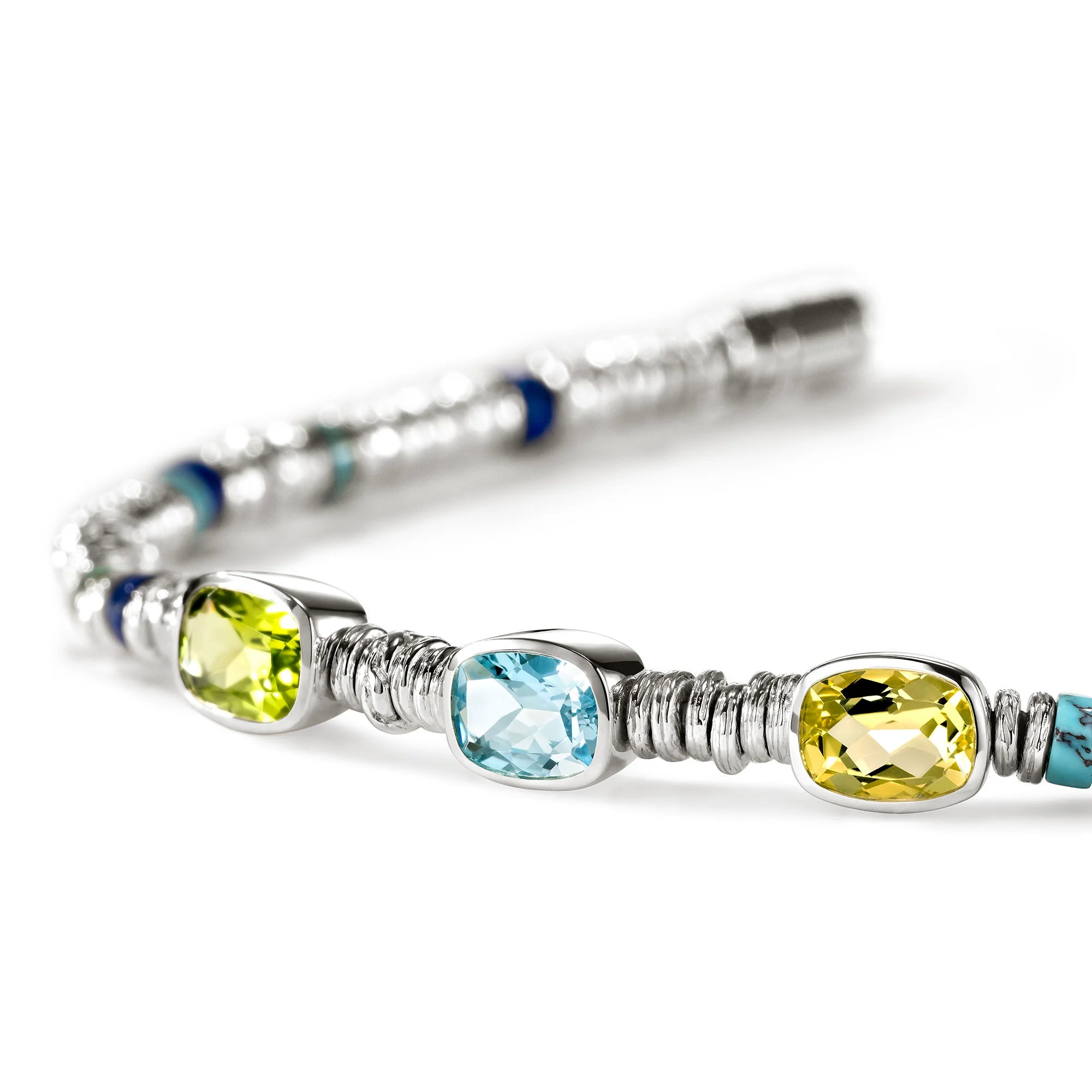 JOHN HARDY HESHI STERLING SILVER BEAD BRACELET WITH 8X6MM PERIDOT, TREATED SKY BLUETOPAZ, LEMON QUARTZ, AND 4MM LAPIS AND TREATED TURQUOISE BEADS WITH PUSHER CLASP. SIZE MEDIUM